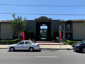 Downey apartment for rent - a white car parked in front of a building