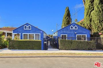 Los Angeles apartment for rent - A blue house with a white window and a black gate.