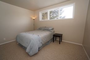 Wainwright apartment for rent - a bedroom with a bed and a window