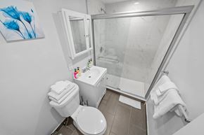 Miami apartment for rent - a bathroom with a toilet sink and a shower