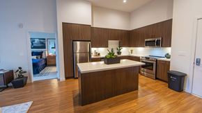 San Bruno apartment for rent - a kitchen with a large island and a stainless steel refrigerator