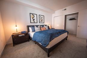 Canoga Park apartment for rent - a bedroom with a large bed and a closet