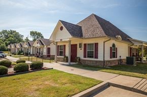 Van Buren triplex for rent - a row of houses in a neighborhood with a sidewalk and grass