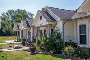 Van Buren triplex for rent - a row of houses with a yard and grass