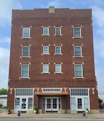 Durant apartment for rent - the front of a brick building with windows and