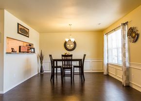 Durant apartment for rent - a dining room with a table and chairs and a window