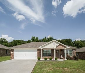Durant apartment for rent - a house with a driveway and a garage door