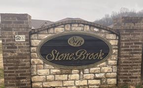 Rusellville apartment for rent - a stone brick building with a sign on it