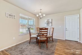 Van Buren apartment for rent - a dining room with a table and chairs and a window