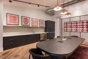 Columbus apartment for rent - A modern dining room with a black table and chairs.