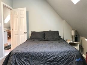Chicago apartment for rent - a bedroom with a bed and a door to a bathroom