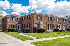Detroit apartment for rent - a brick apartment building with a sidewalk in front of it