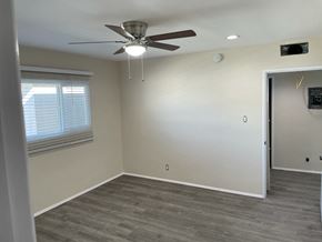Glendale apartment for rent - a living room with a ceiling fan and a window