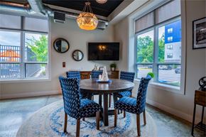 Pittsburgh apartment for rent - a dining room with blue chairs and a wooden table