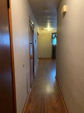 East Mckeesport apartment for rent - a hallway with a wooden floor and a door