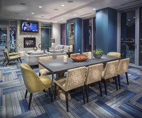 Houston apartment for rent - A modern dining room with a large table and chairs.