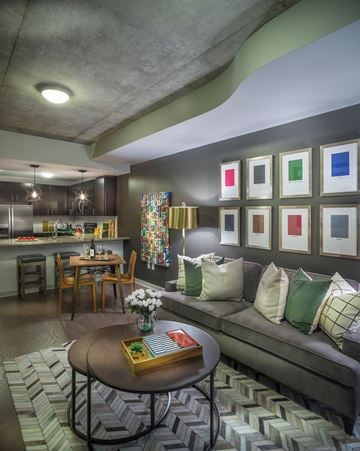Houston apartment for rent - A living room with a grey couch and a coffee table.