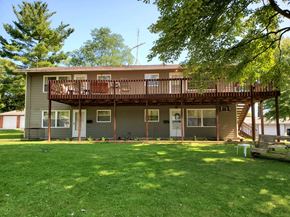 Wadsworth apartment for rent - A house with a balcony and a green lawn.