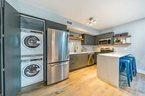 Miami Beach apartment for rent - a kitchen with stainless steel appliances and a washer and dryer and a counter