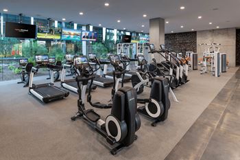 Indoor & outdoor fitness center with cardio, strength training, free weights, stretching, yoga & outdoor fitness area