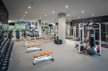 Indoor & outdoor fitness center with cardio, strength training, free weights, stretching, yoga & outdoor fitness area