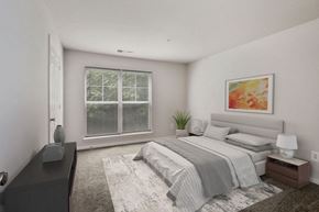 Owings Mills apartment for rent - an empty bedroom with a bed and a large window