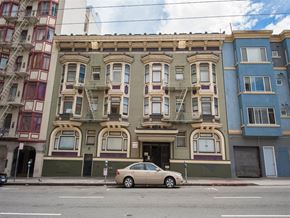 San Francisco apartment for rent - a car parked in front of a building on a street