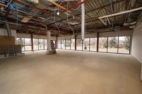 Fort Saskatchewan apartment for rent - a large empty room with windows in a building