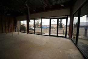 Fort Saskatchewan apartment for rent - an empty room in a building with glass doors