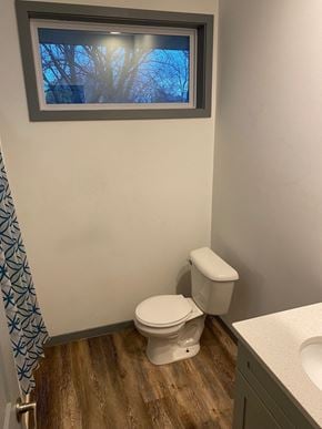 Saint Paul apartment for rent - a bathroom with a toilet and a window