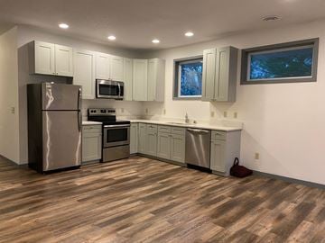 Saint Paul apartment for rent - a kitchen with stainless steel appliances and white cabinets