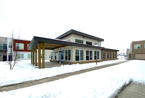 Madison apartment for rent - A building with a brown roof and a covered walkway.