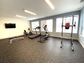 Madison apartment for rent - A spacious home gym with a variety of exercise equipment.