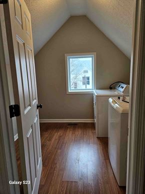 Saint Paul apartment for rent - A small room with a door, a window, and a washing machine.