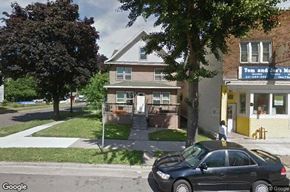 Saint Paul apartment for rent - A black car is parked in front of a house.