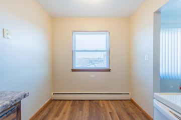 St. Paul apartment for rent - A room with a window and wooden floors.