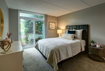 Beautiful bright bedroom with wide windows