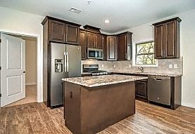 Elizabeth apartment for rent - A kitchen with brown cabinets and a granite counter top.