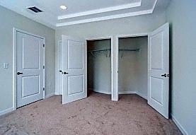 Elizabeth apartment for rent - A room with white doors and carpeted floor.