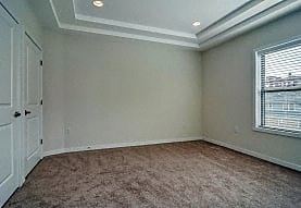 Elizabeth apartment for rent - A room with a carpeted floor and a window with blinds.