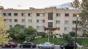 Denver apartment for rent - the exterior of an apartment building with cars parked in front