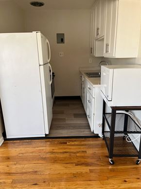 Denver apartment for rent - a kitchen with white appliances and a wood floor