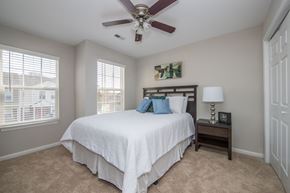 Newport News apartment for rent - Carpeted bedroom with ceiling fan at Villages at City Center apartments in Newport News VA