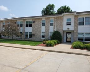 Albert Lea apartment for rent - an apartment building with a sidewalk in front of it