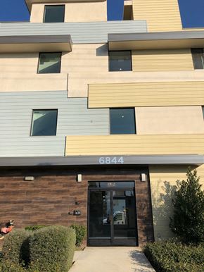 Van Nuys apartment for rent - a building with a door and a sidewalk in front of it