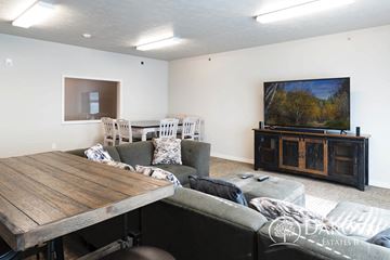 Aberdeen apartment for rent - A living room with a wooden table and grey couch.