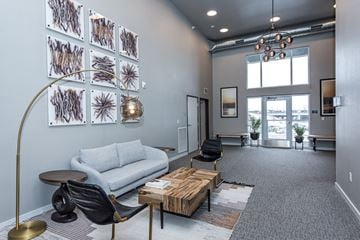 Lakeville apartment for rent - A living room with a grey carpet and a white sofa.