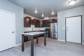 Lakeville apartment for rent - A kitchen with a table and chairs in the middle of the room.