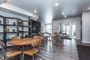 Lakeville apartment for rent - A modern dining room with a wooden table and chairs.