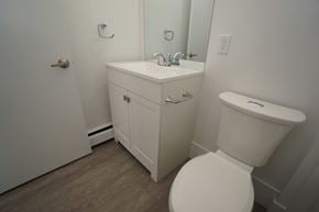Edmonton apartment for rent - a bathroom with a toilet sink and mirror